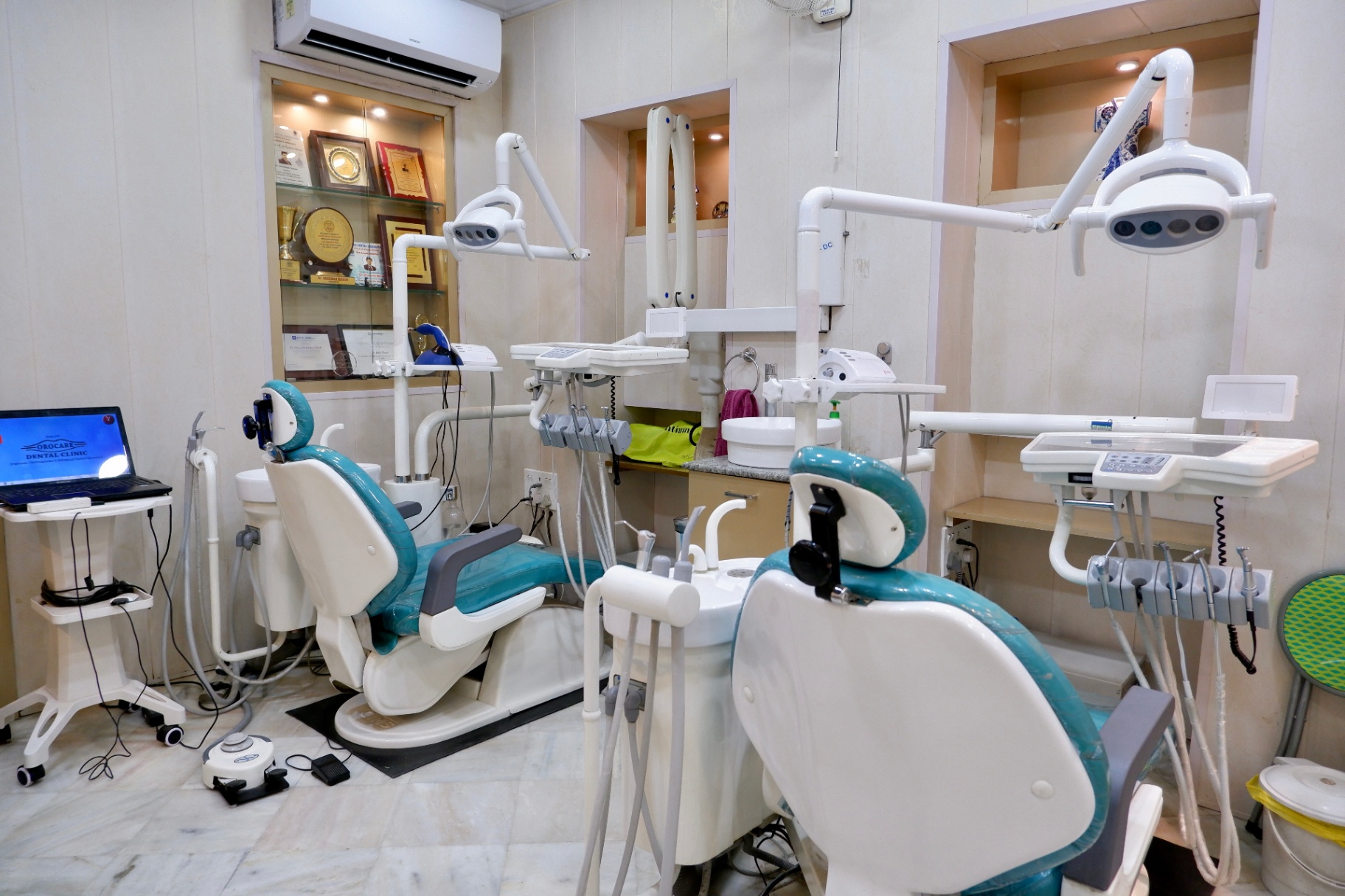 Twin dental chairs and treatment lights inside the OroCare Dental Clinic Bhowanipur treatment room